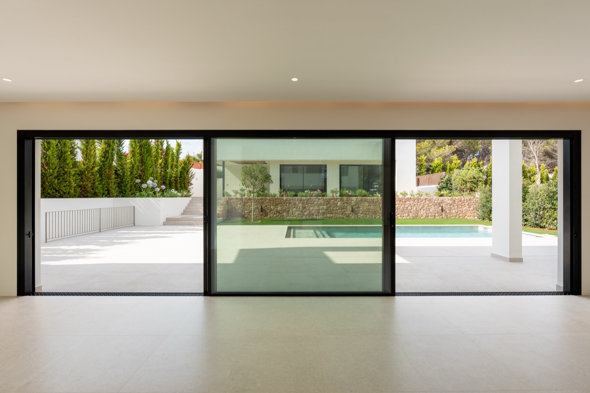 Covered terrace dining, timber ceiling over the pool